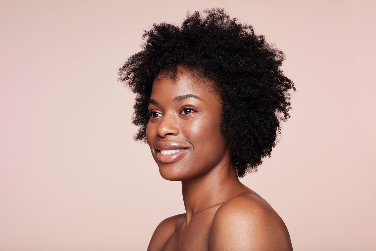 Woman smiling with smooth facial features