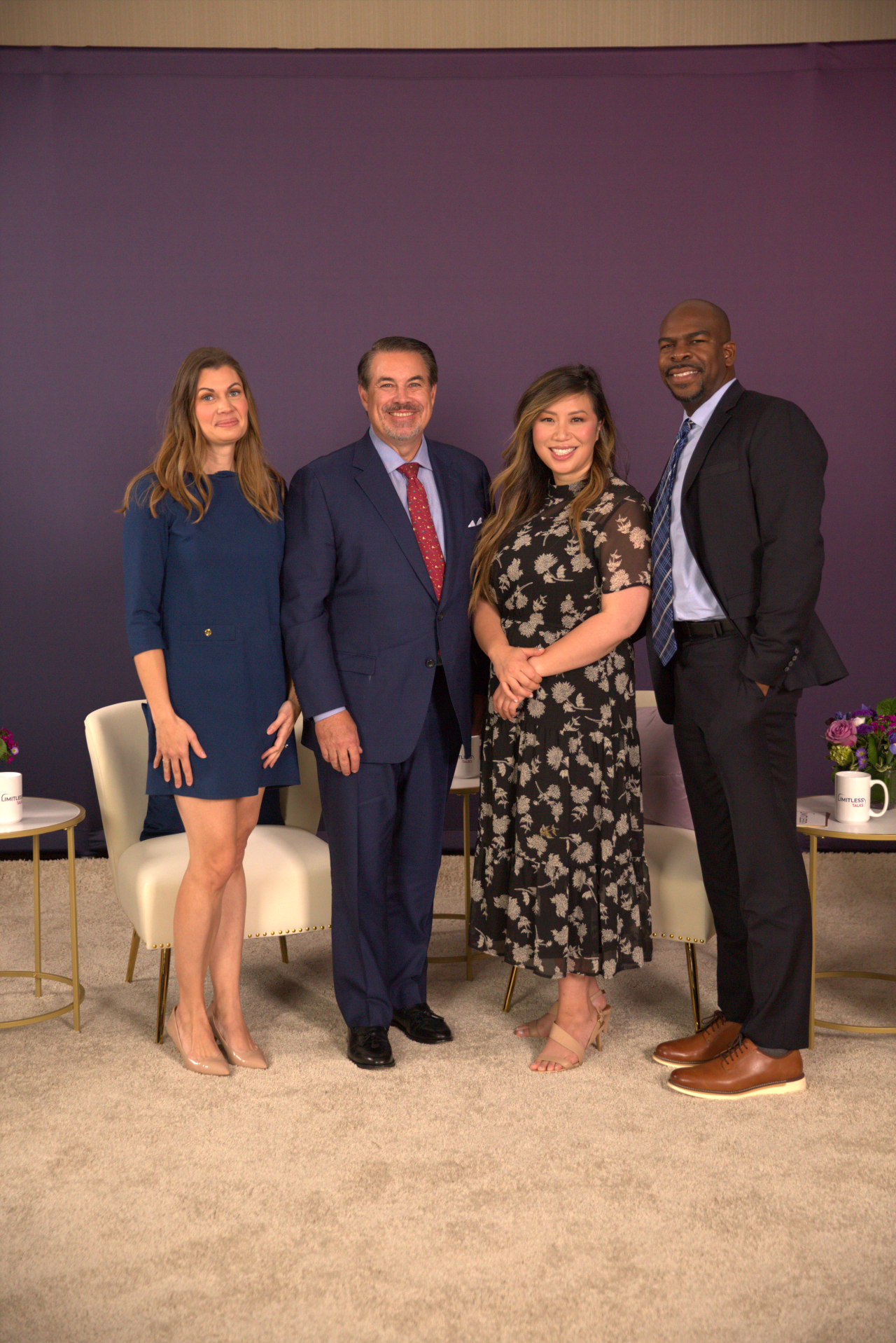 Four employees smiling