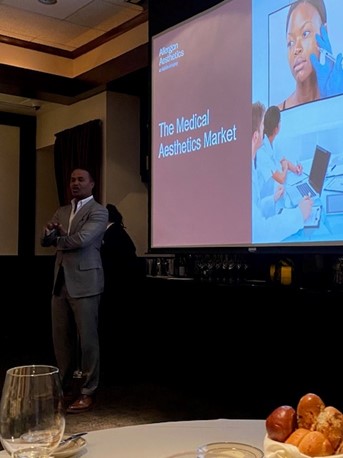 Man giving a presentation on a stage