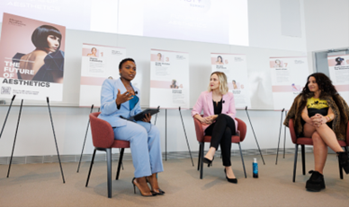 Three women sitting in a circle while conversing