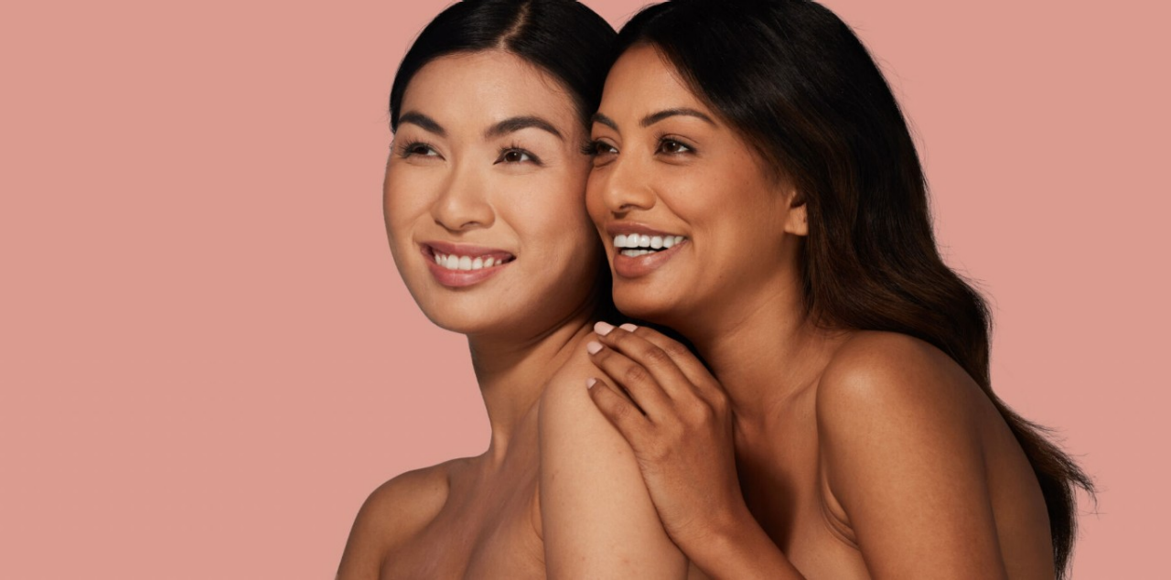 Two women with smooth skin smiling